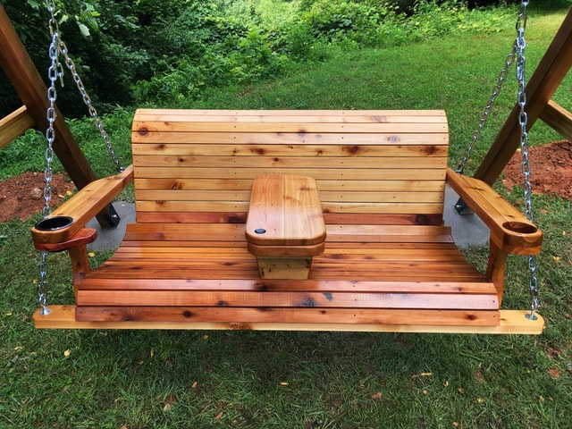 wooden porch swing with cupholders and table